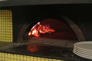 The pizza oven at Sotto using white oak. The oven was imported in pieces from Italy and constructed by a master Italian pizza oven craftsman. It's still hot enough in the AM that they bake the nicely crusty bread in the oven.