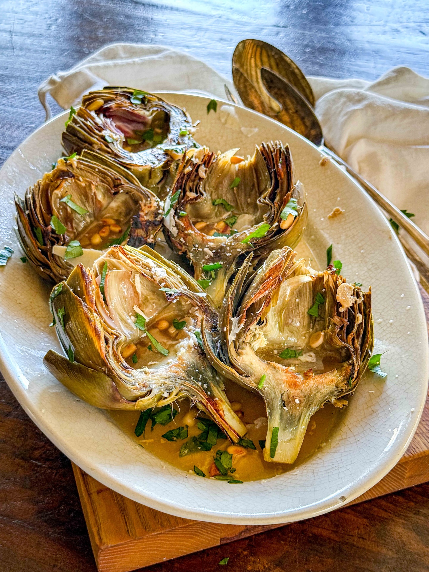 Braised Artichokes with Pecorino and Pine Nuts | OurItalianTable.substack.com