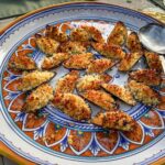 food picture of cooked stuffed mussels on a plate